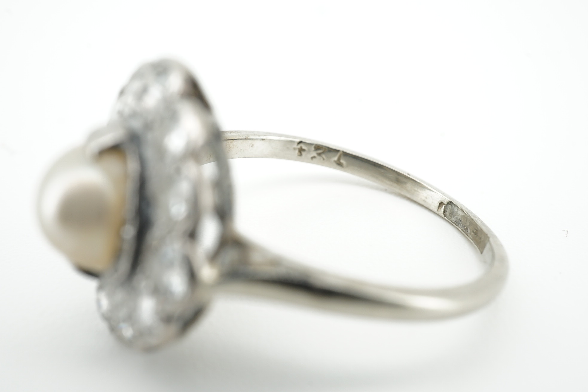 An 18ct and plat. cultured pearl and diamond set circular cluster ring, size O, gross weight 3.5 grams. Condition - fair